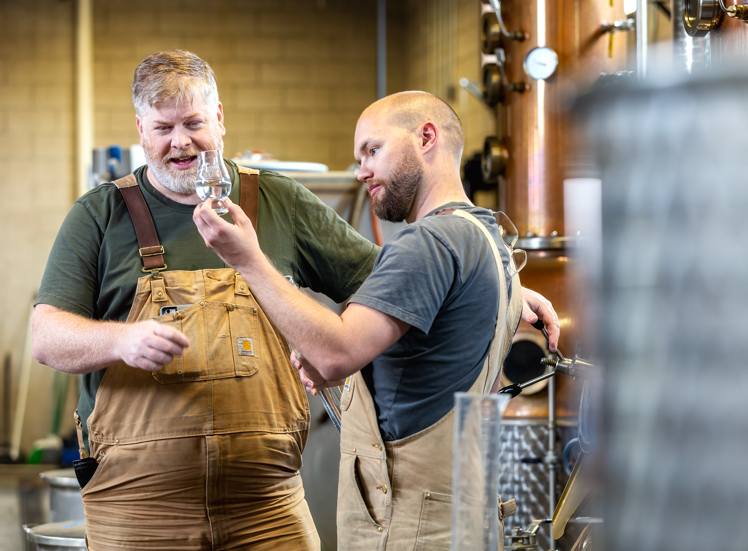 Master Distiller and distiller  checking on progress of whiskey for Distilled Magazine