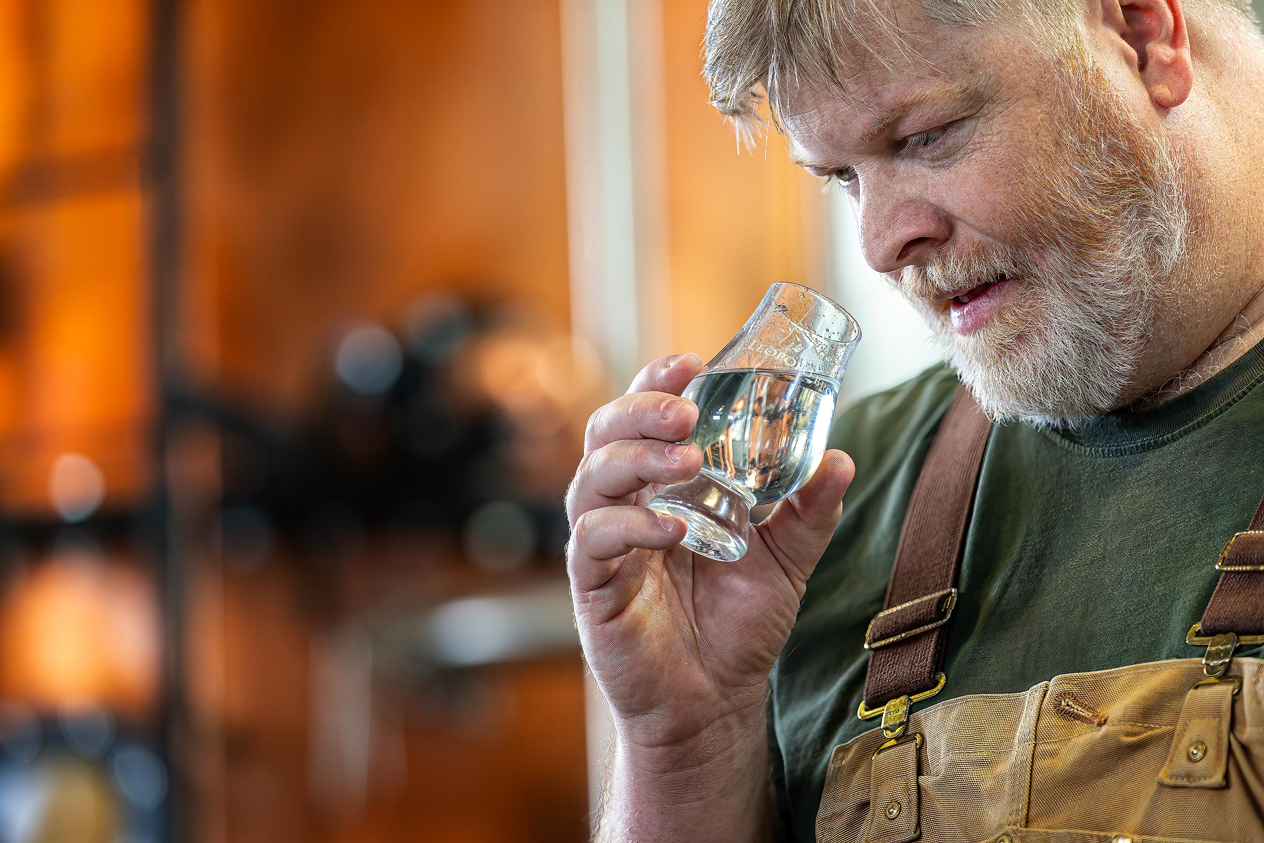 Master Distiller of Leopold Whiskey tasting whiskey for Distilled Magazine