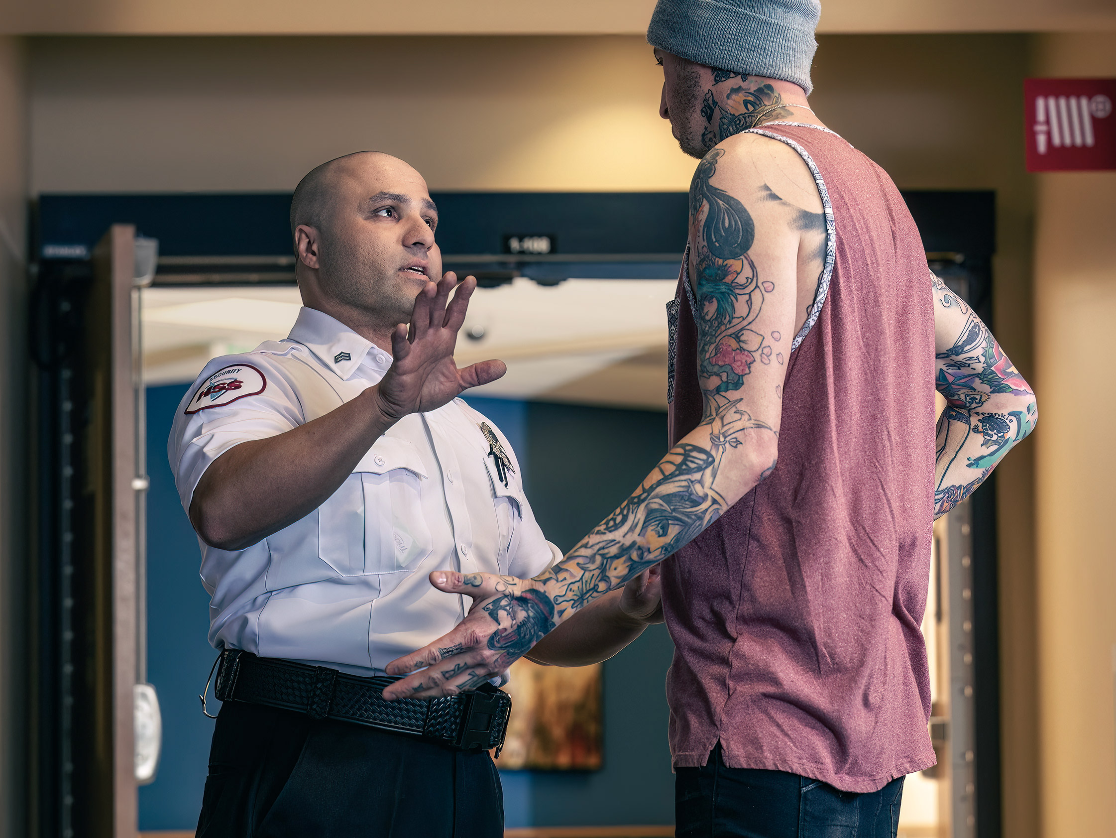 Security Guard stopping trespasser in hospital for HSS advertising. 