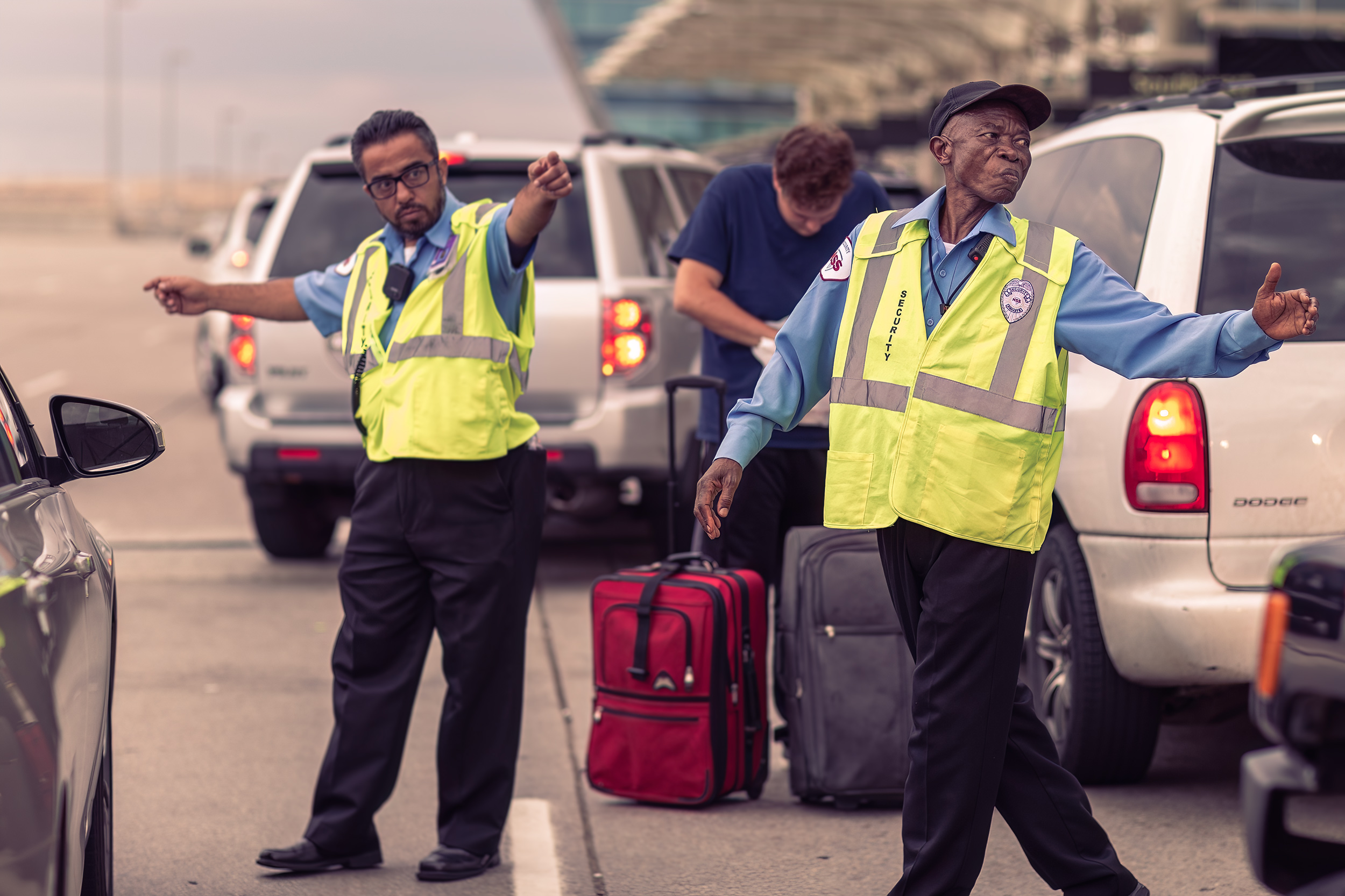 Security Guards directing traffic at airport for HSS advertising. 