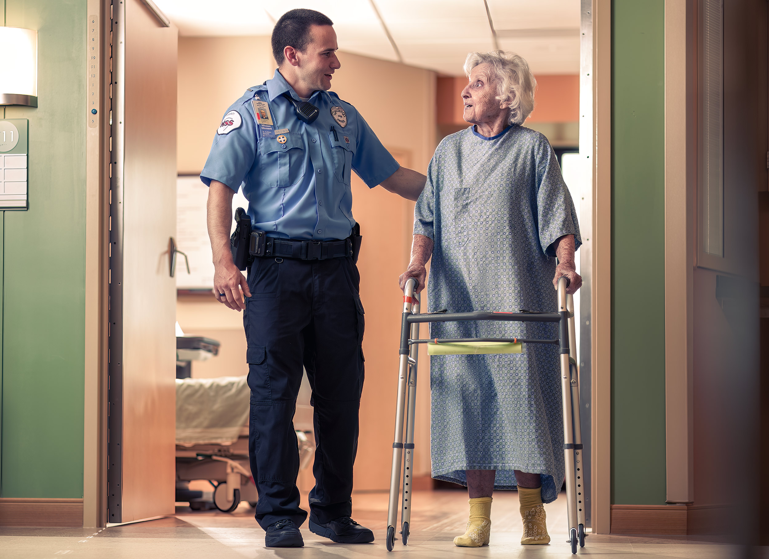 Security Officer helping hospital patient for HSS advertising. 