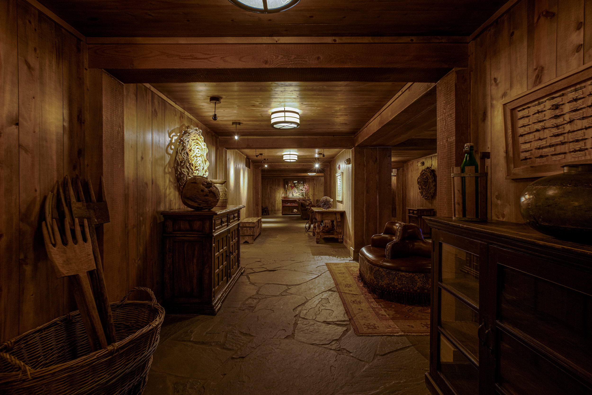 Interior hallway with wooden rakes in basket  for Devils Thumb Ranch