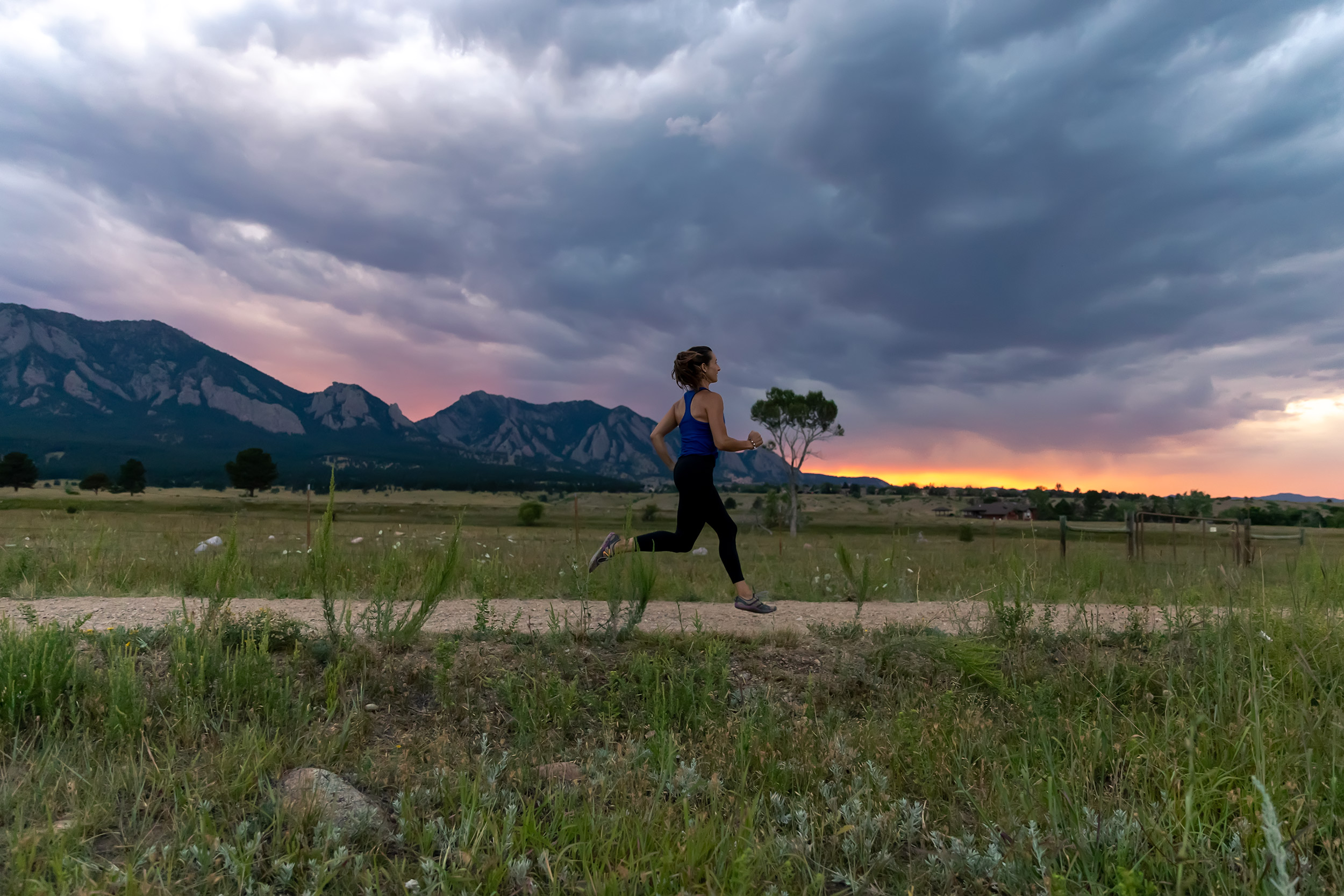 Young fit woman Trail Running on a trail during Summer in Colorado