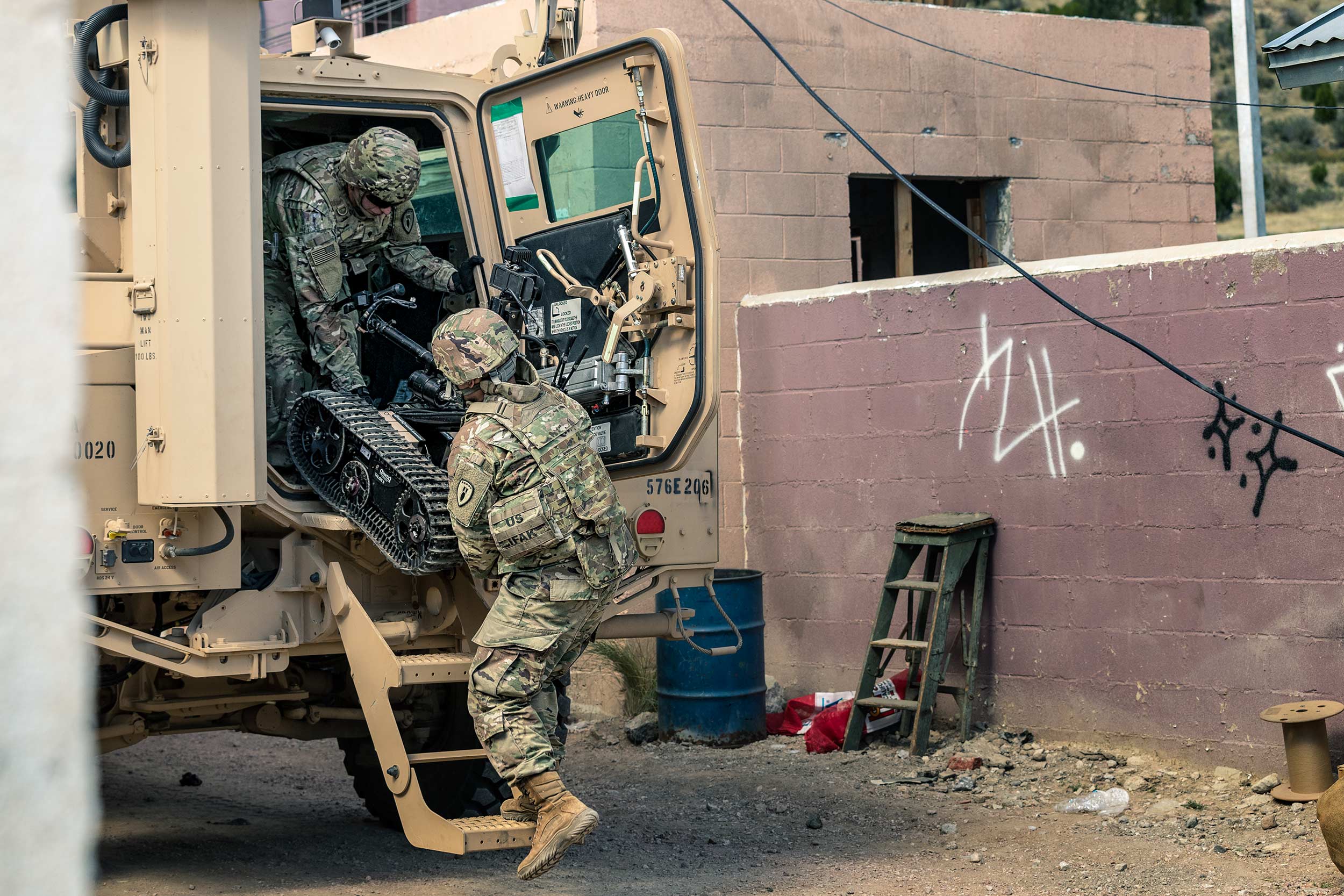 US Army Soldiers unloading TALON