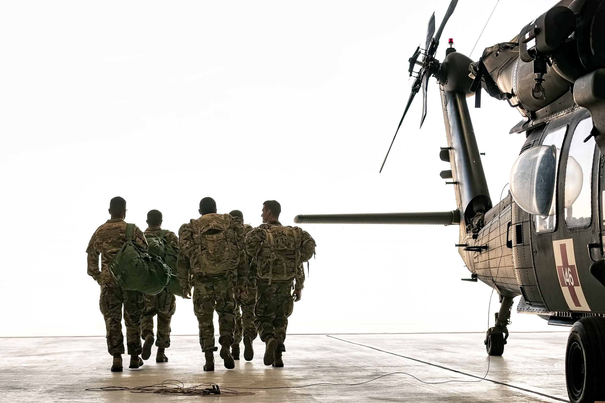 Soldiers leaving hanger US Army Advertising