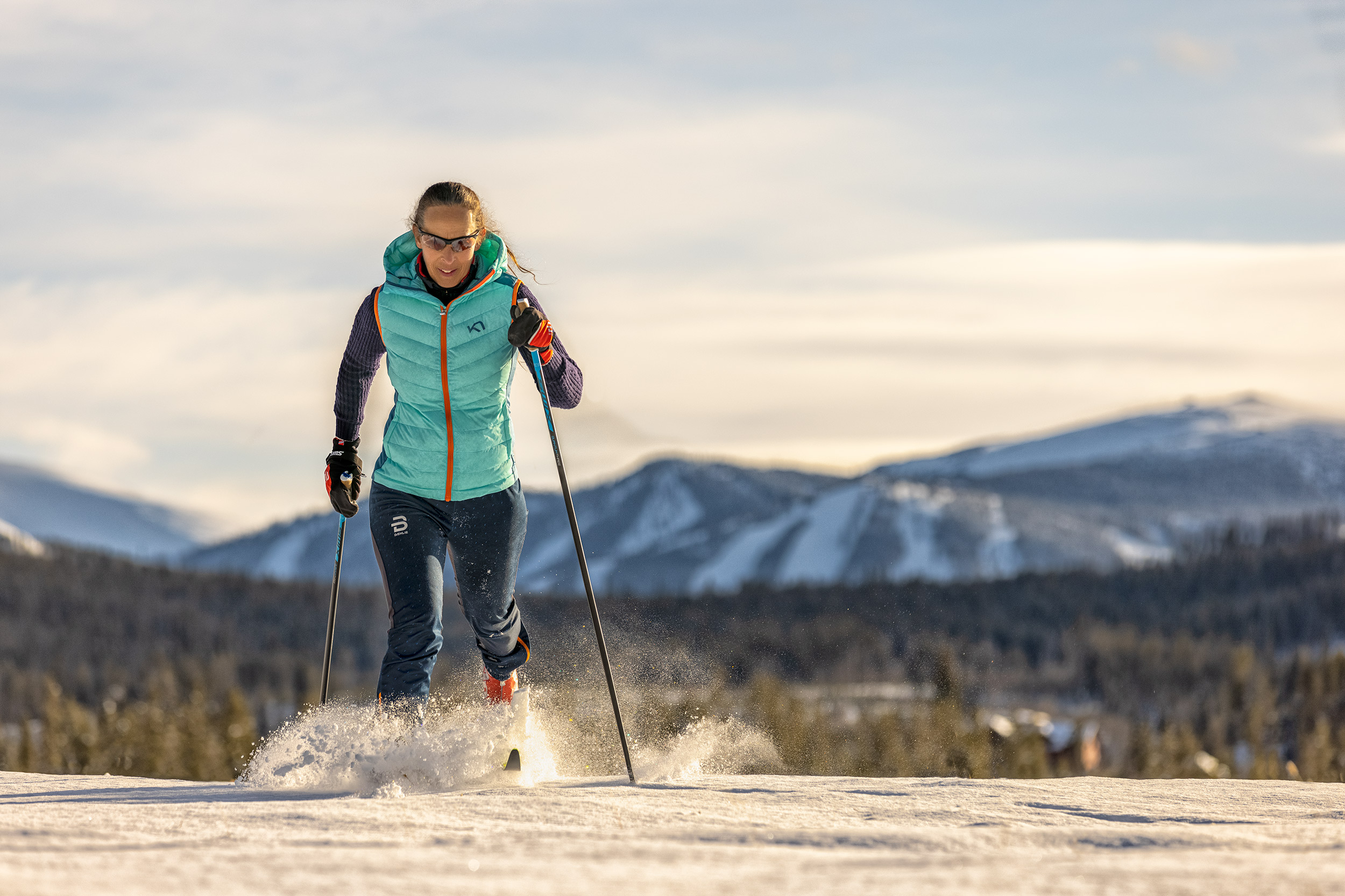 Woman Cross Country Skate Skiing in the Mountains for Devil