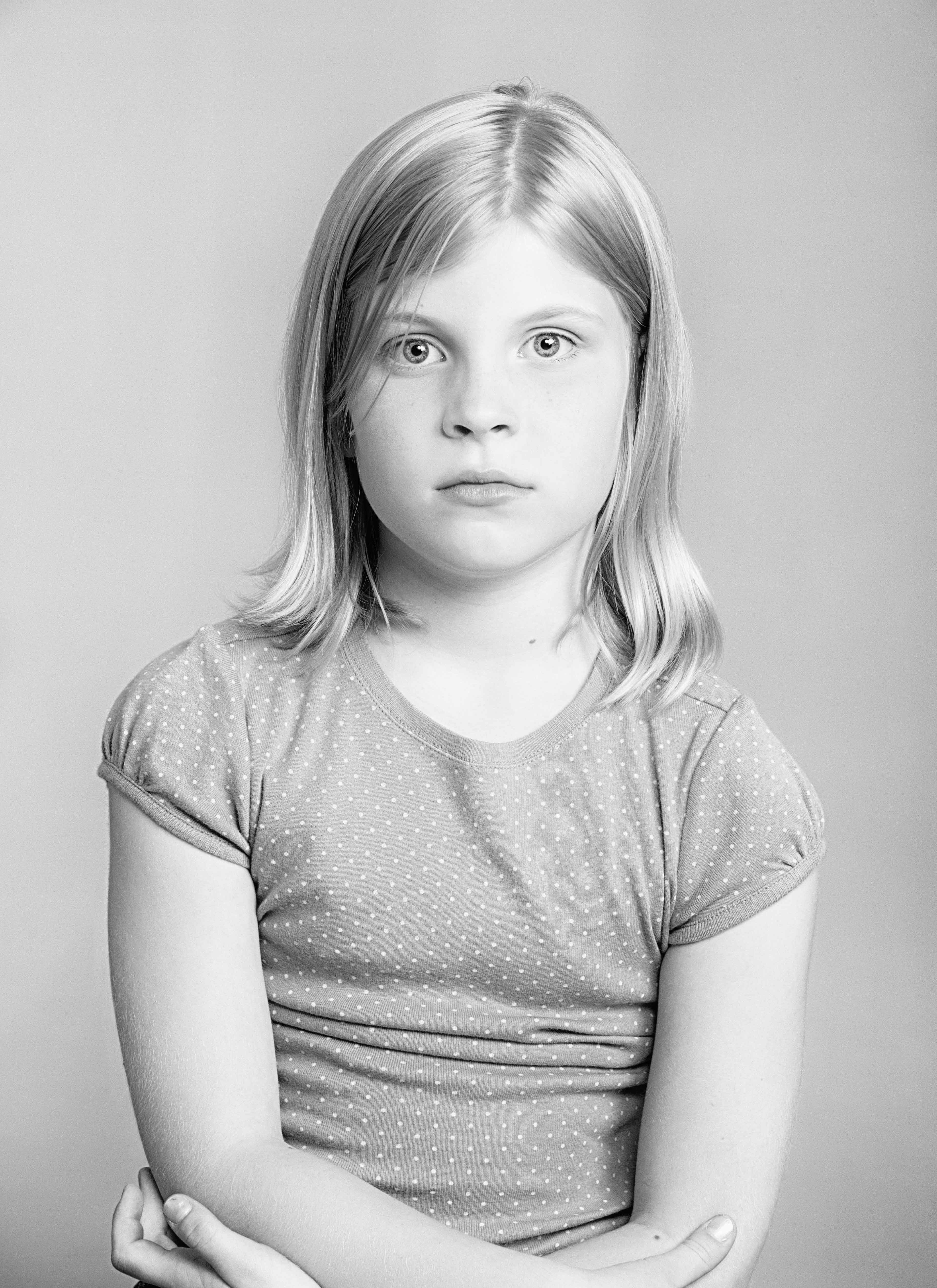  close up photography portrait of a young girl in black and white on a white background