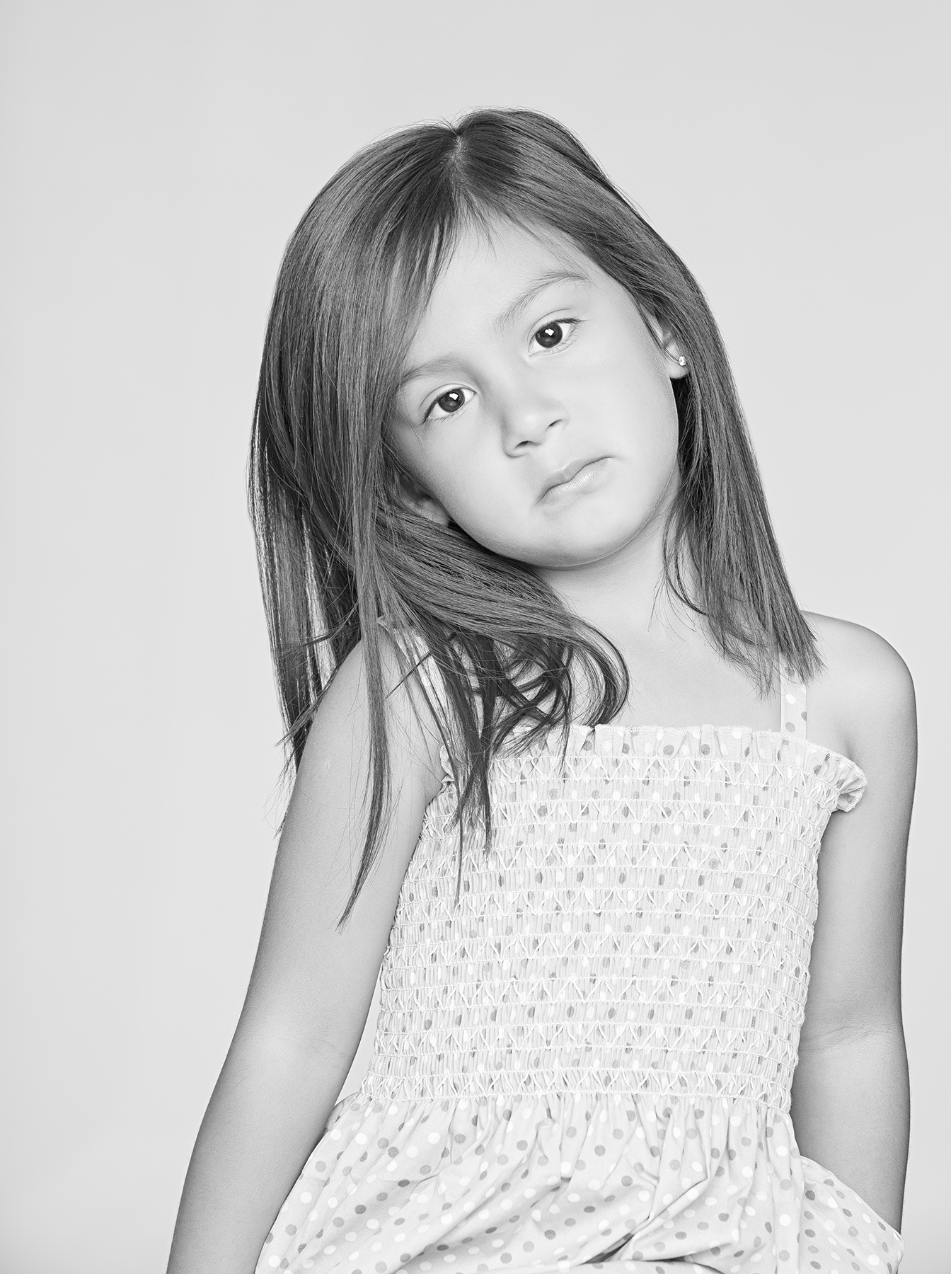  close up photography portrait of a young girl in black and white on a white background
