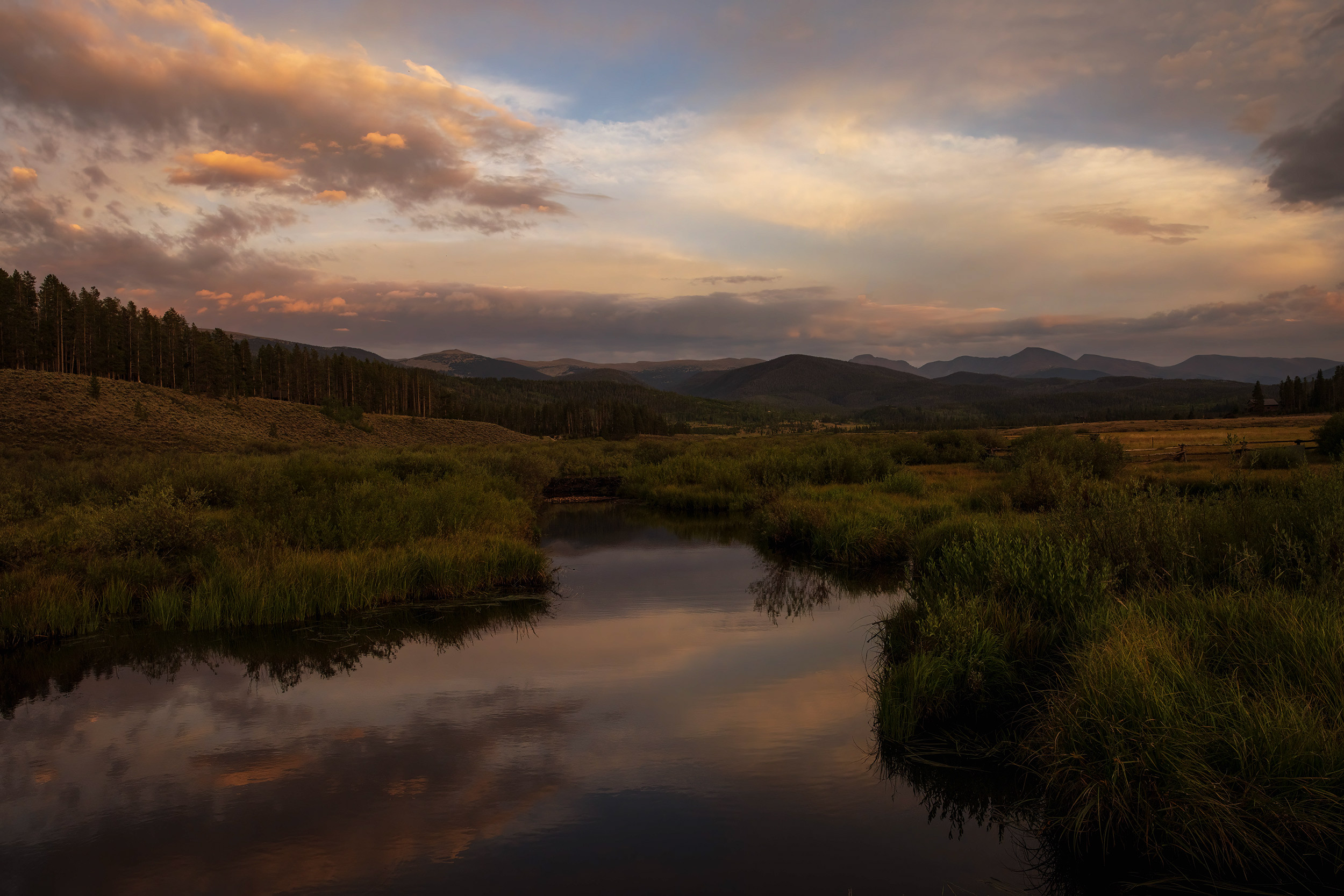 Architecture Photography sunset landscape of valley creek and mountains  for Devils Thumb Ranch