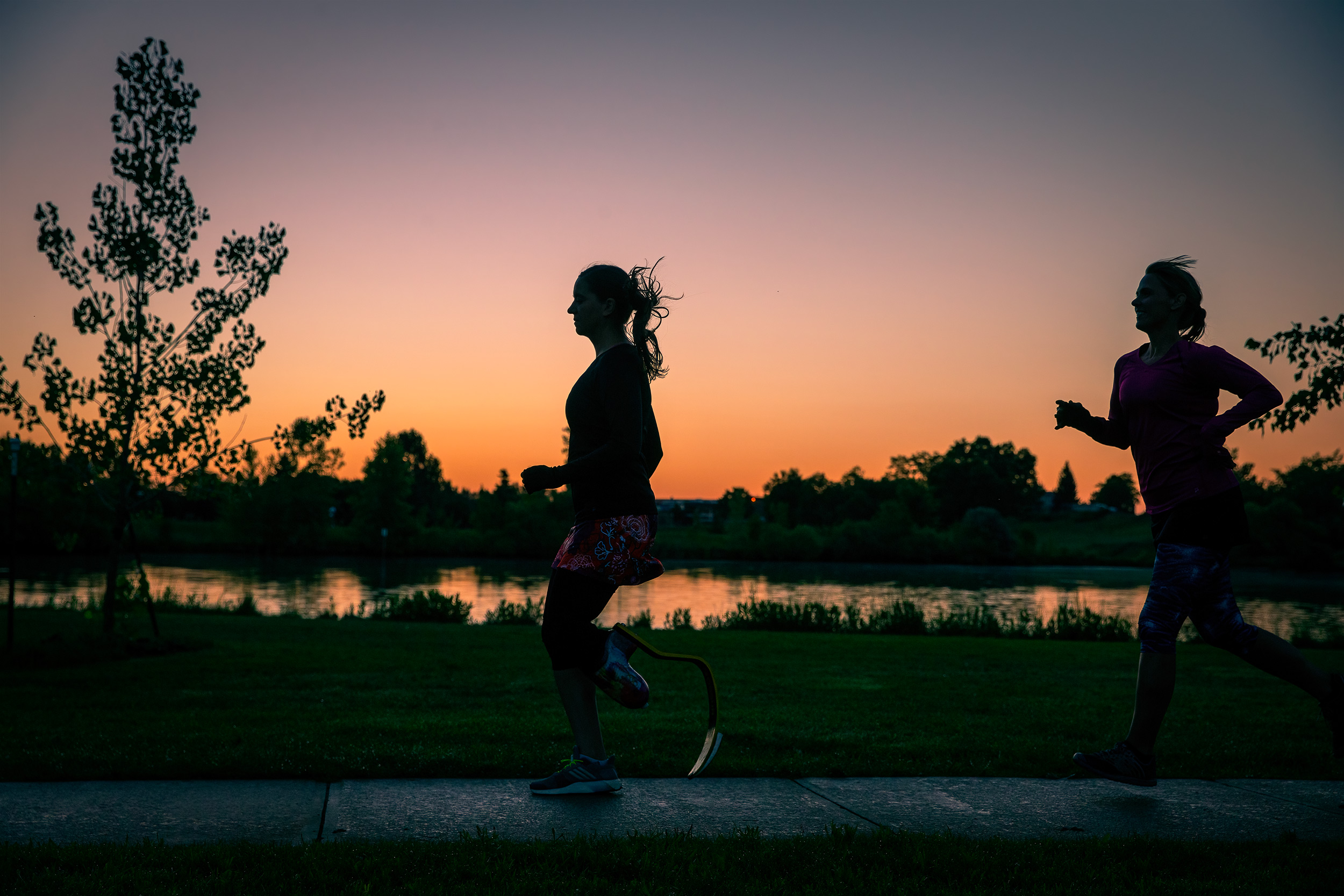 Two women running at sunrise for Skirtsports