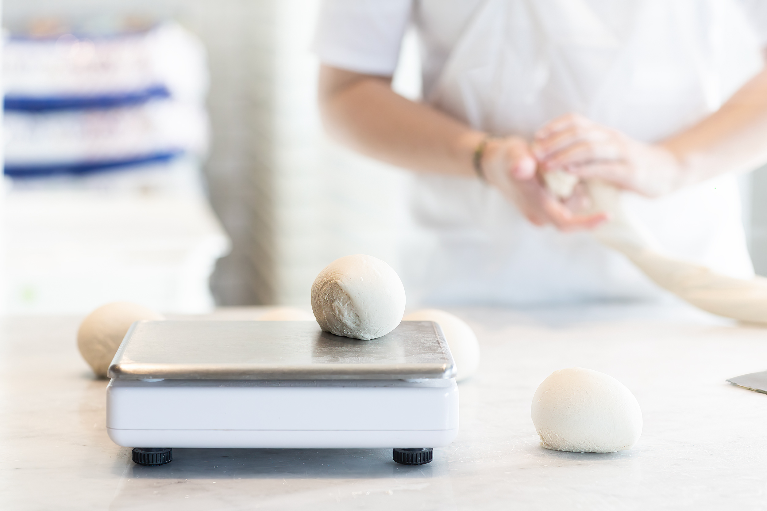 Measuring Pizza dough for Pizzaria Locale